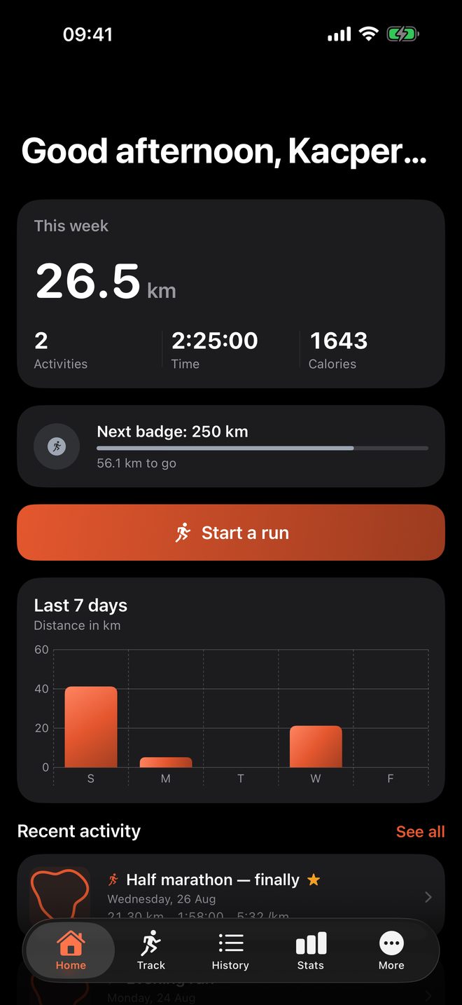 The home screen showing this week's distance and the next badge.